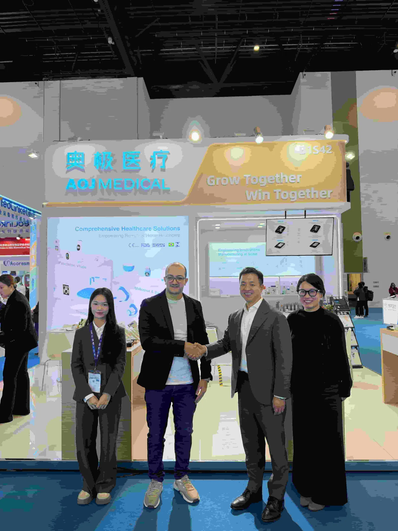 A new partnership begins — handshake at the AOJ Medical booth, CMEF Beijing 2026